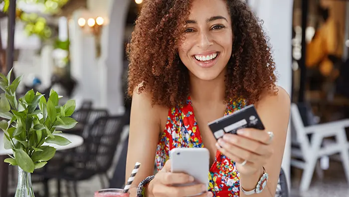 smiling woman with debit card